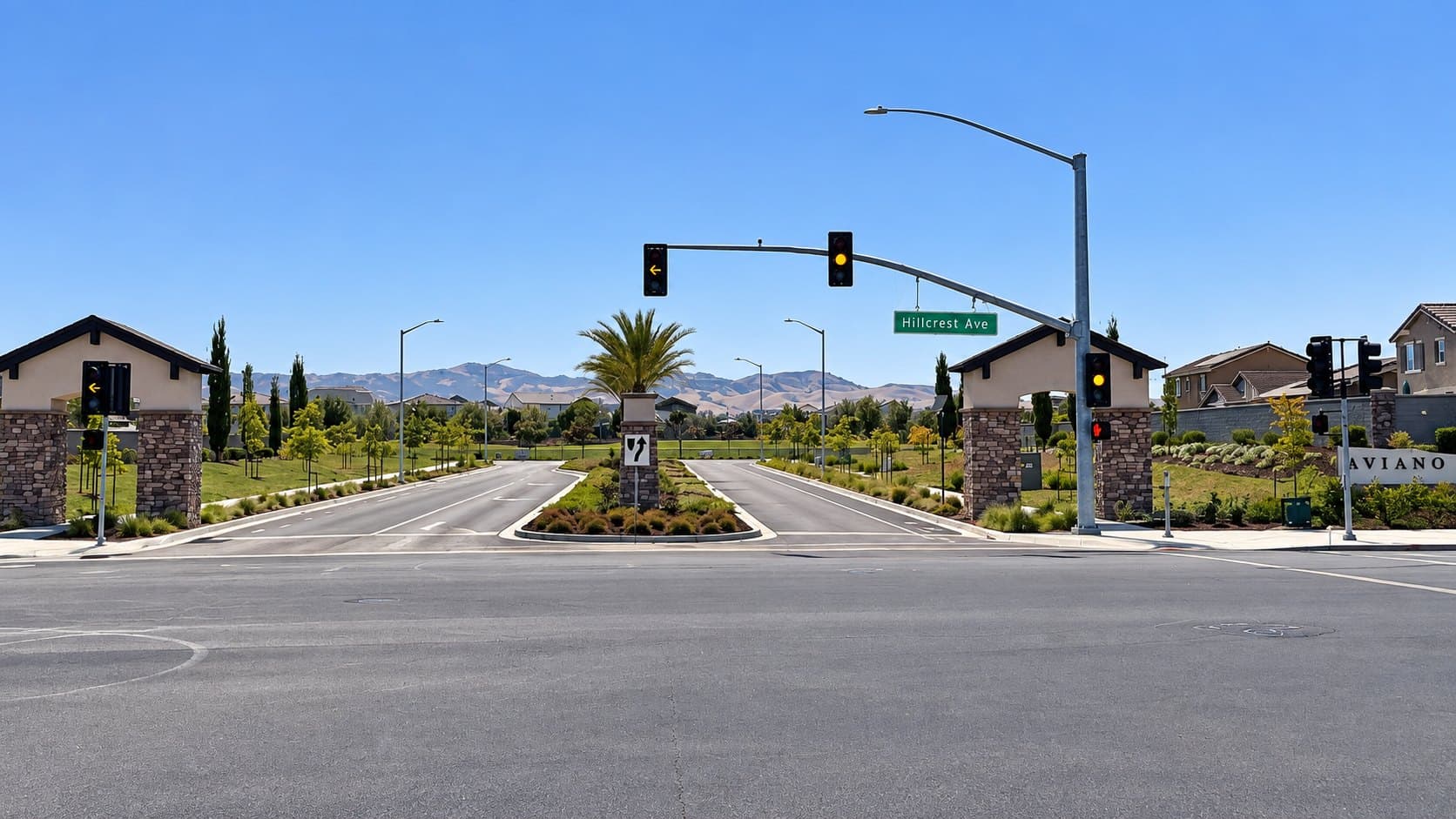 Entrance to the Aviano neighborhood at Hillcrest Avenue with hills beyond